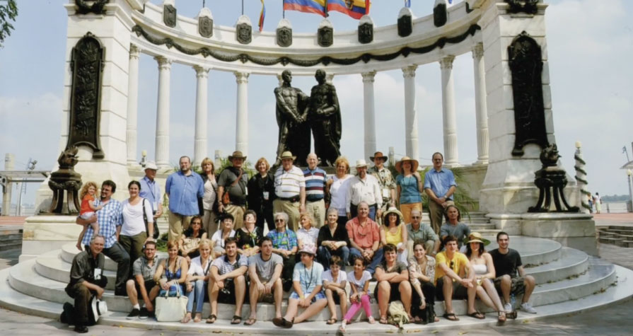 Descendants of Jewish refugees, now living abroad, return for a reunion to Ecuador--land of their birth. In Guayaquil they pose by the waterfront.